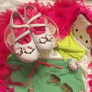 ADORABLE sketechers with 2 sets of removable hello kitty chrams!